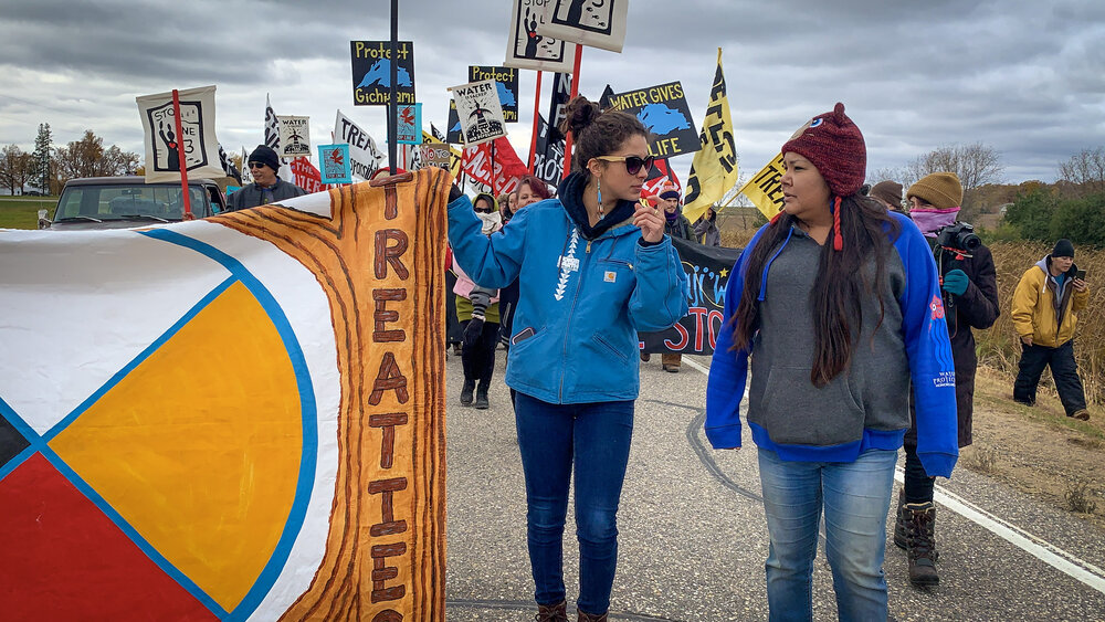 Angel Stevens - “Rice Lake, first week of harvest l50,000 pounds of green rice, that’s who we are, that’s our village,” she told the crowd. “You should come visit our reservation,” she told the crowd. Then she talked about the water quality in Rice Lake. “If you run my tap, the water comes out orange, that’s not right.”